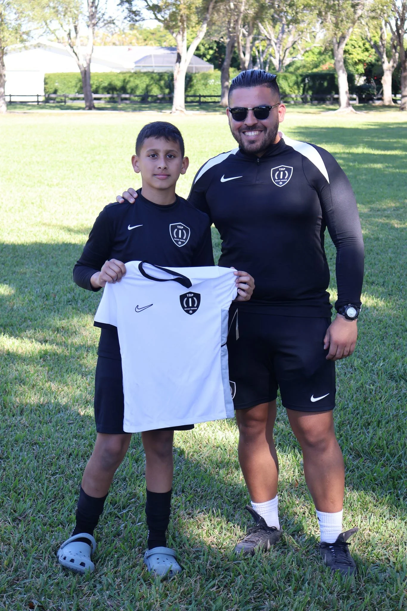 Outstanding player receiving the prestigious Top 1 Player Award at Top 1 Soccer Training soccer camp and clinic.