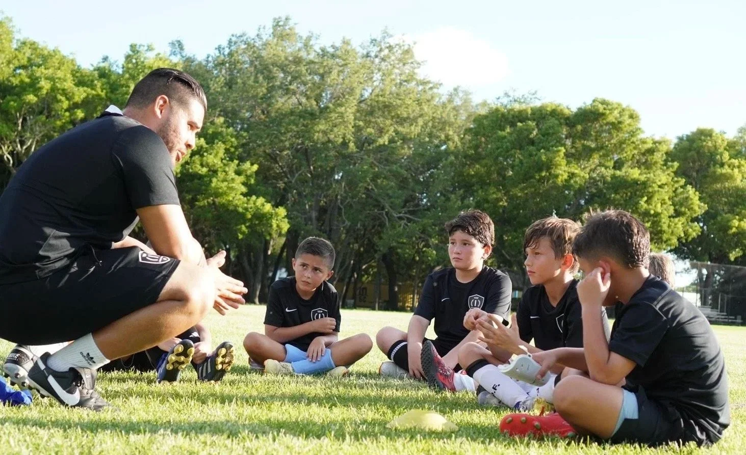 Coach Christian Acevedo leading a high-performance soccer training session in Miami, FL.
