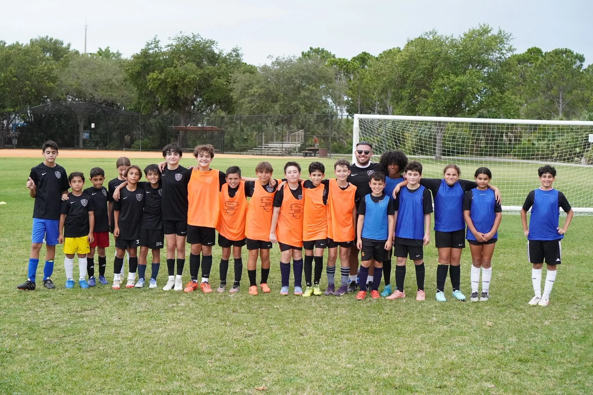 Players participating in a Top 1 Soccer Training summer soccer camp at Coral Reef Park