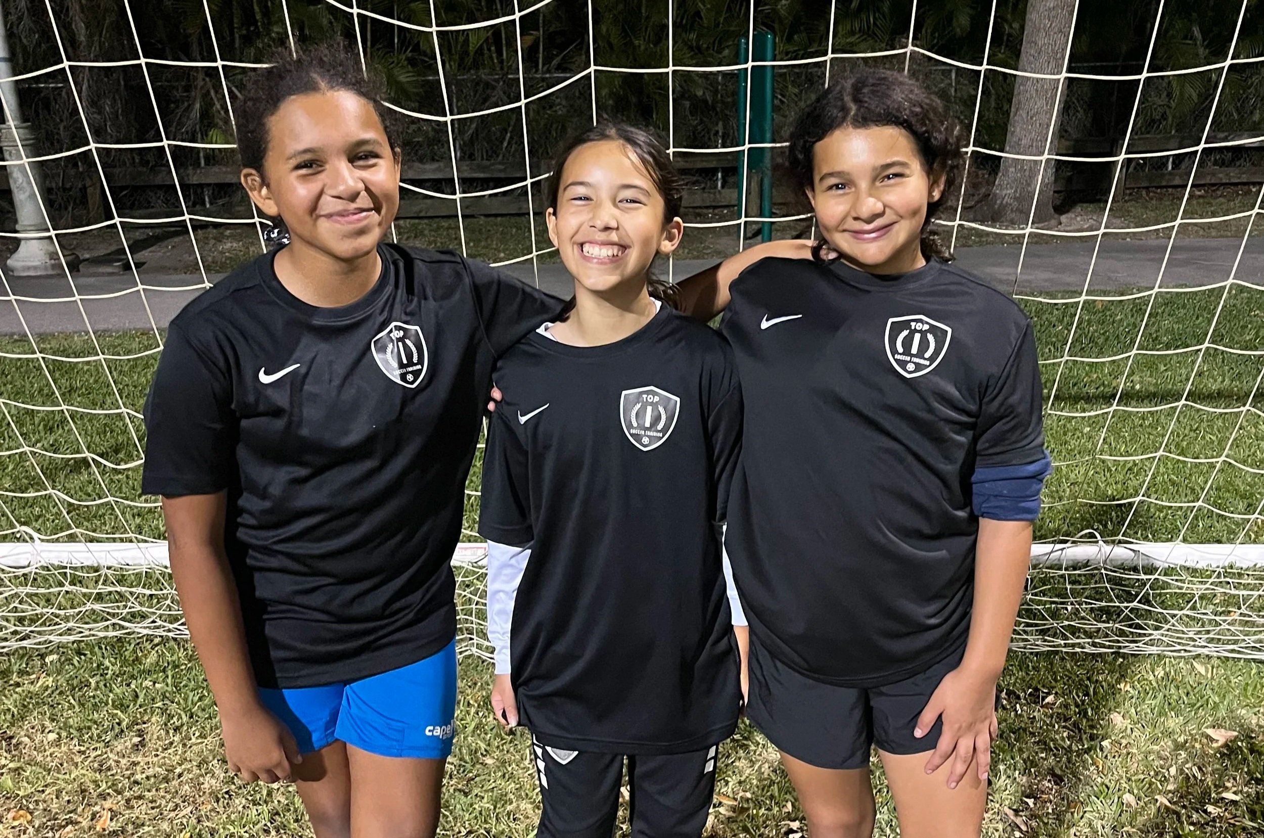 Youth athletes developing technical skills during a Top 1 Soccer Training clinic