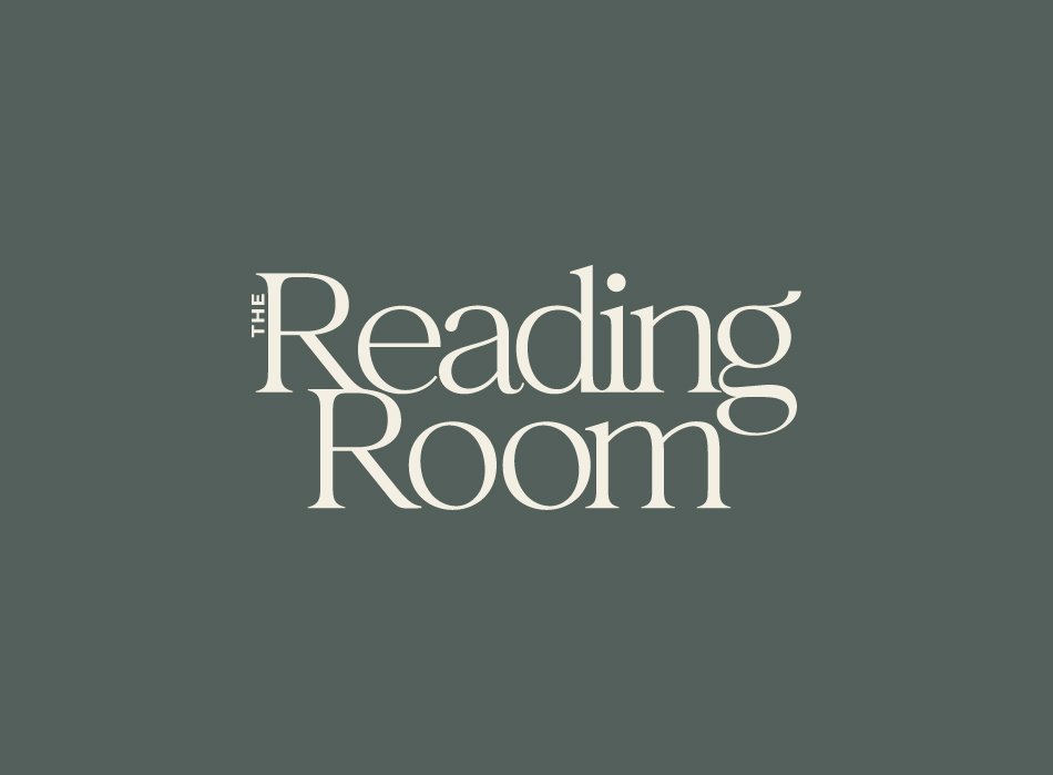 Logo for The Reading Room on a dark gray background.