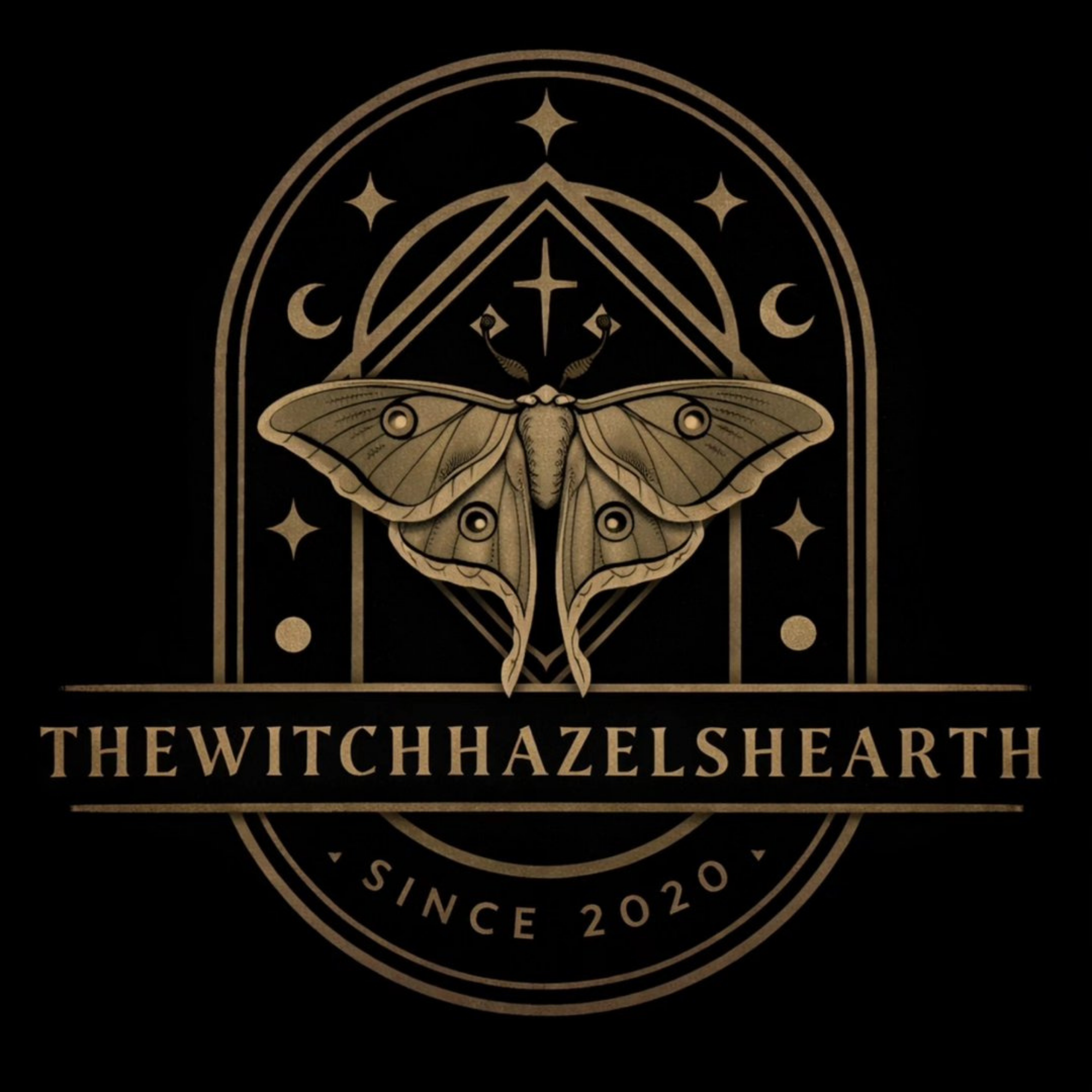 A black background with a gold-colored circular symbol featuring an intricate moth with outstretched wings, surrounded by celestial symbols like moons and stars, and the text 'The Witch Hazel's Heart Since 2020' underneath.
