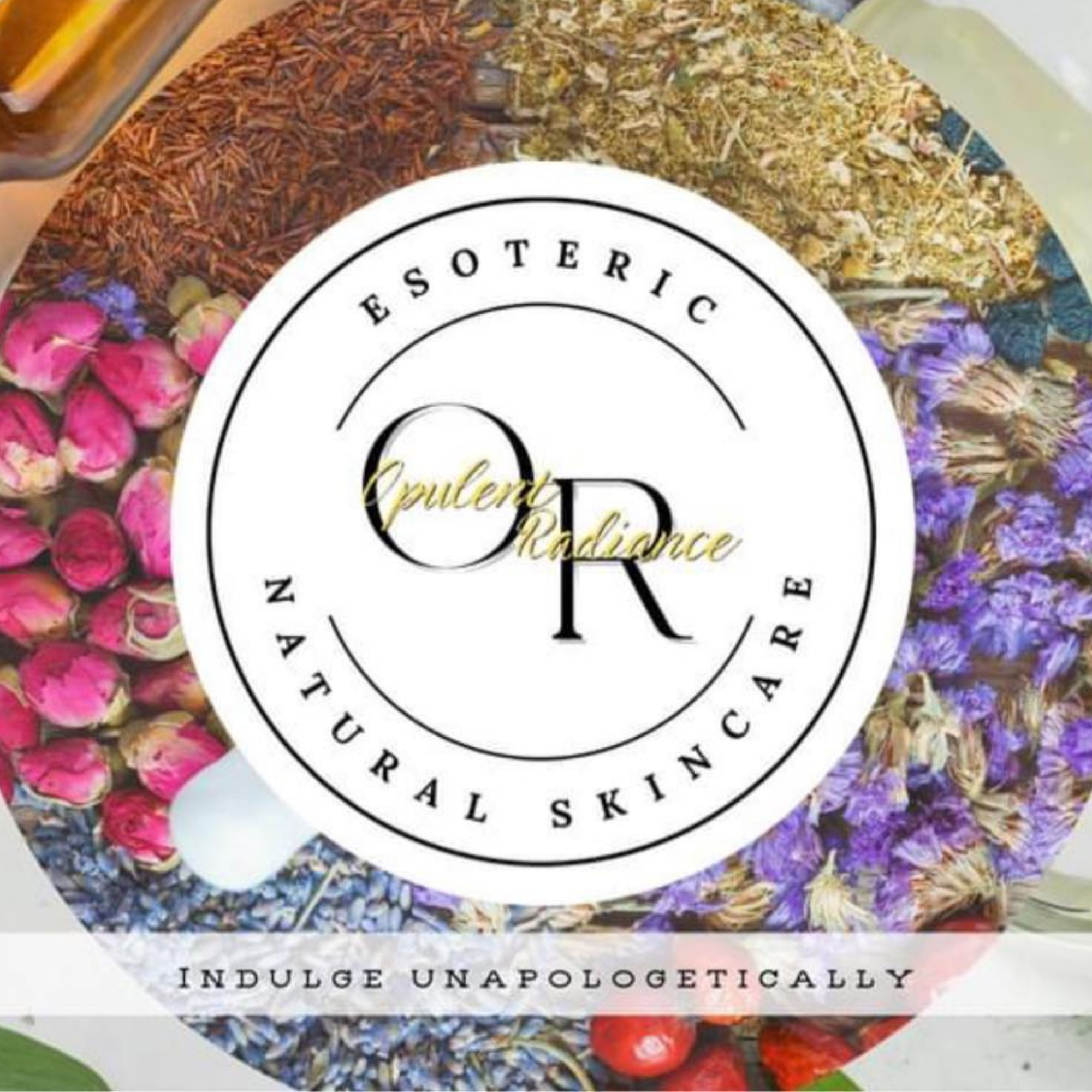 Close-up of various dried herbs and flowers arranged in a circular pattern around a central label that reads 'Eucharistic Adoration' and includes the phrase 'Indulge Unapologetically.'