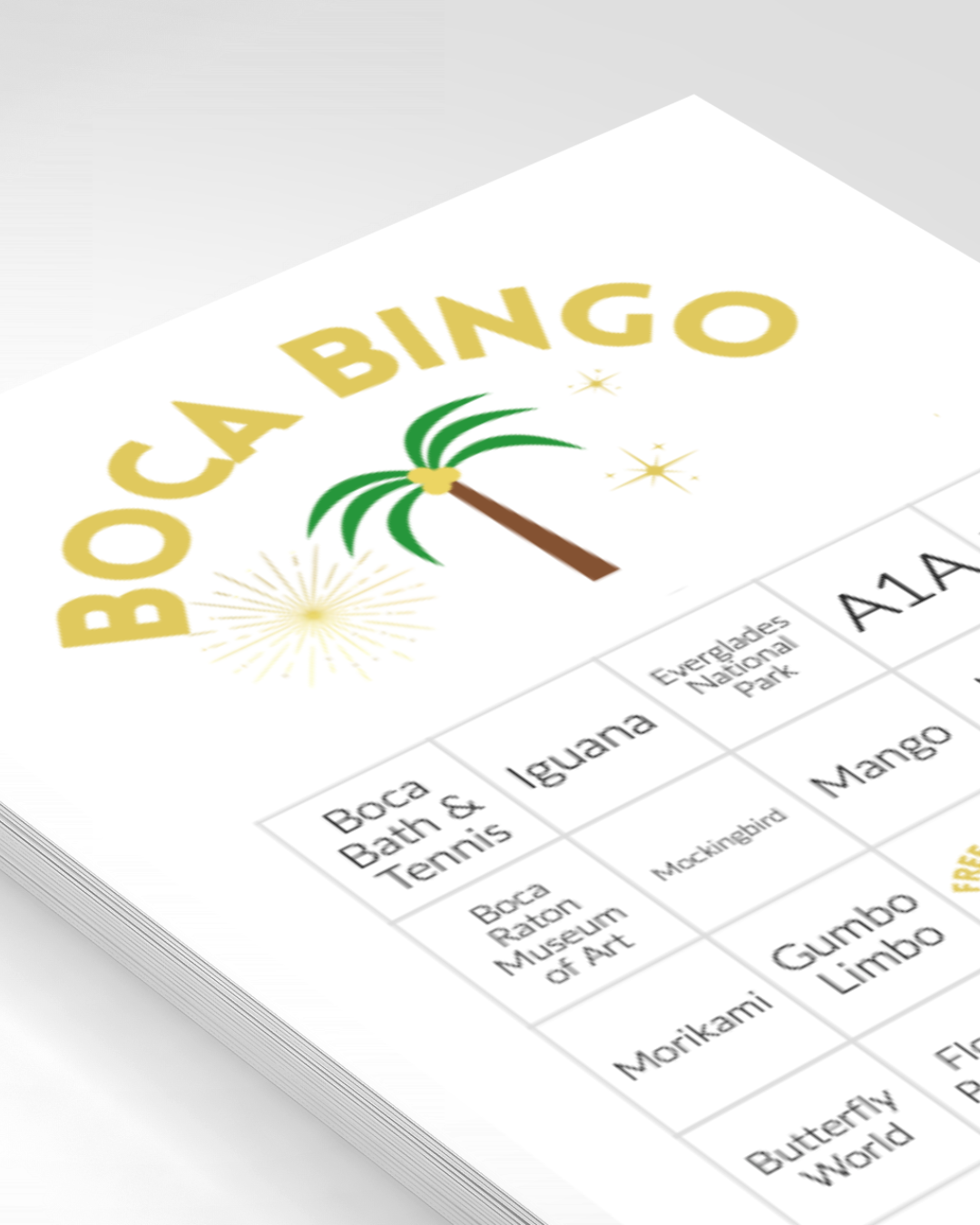 Bingo sheet with tropical theme, featuring a palm tree and fireworks graphics labeled 'Boca Bingo,' listing attractions like Boca Raton Museum of Art and Morikami.