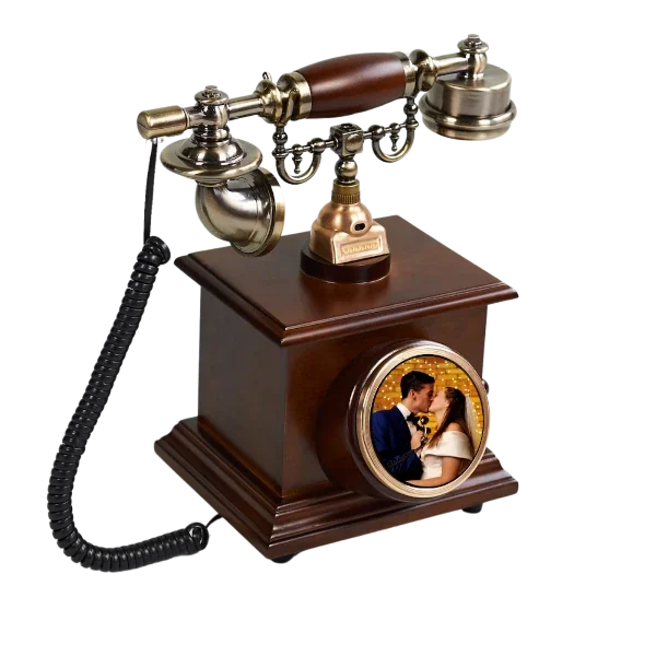 A vintage-style telephone with a wooden base and a rotary dial, featuring a photo of a couple kissing inside the dial.