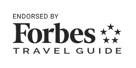 Black text on white background that reads, 'Endorsed by Forbes Travel Guide.'