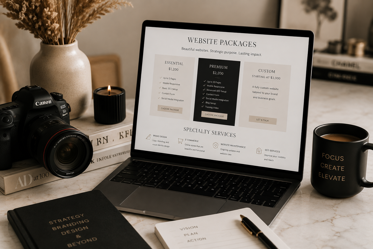 Laptop on a desk displaying website packages for web design services with three options: Essential, Premium, and Custom. The desk has a camera, a book, a notebook, a pen, a candle, a coffee mug with the words 'Focus, Create, Elevate', and a vase with dried flowers.