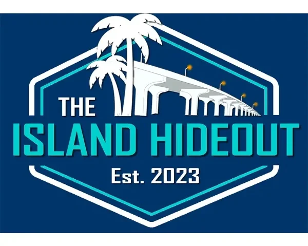 Logo for The Island Hideout, established in 2023, featuring palm trees, a bridge, and a shield design.