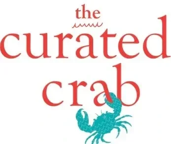 Text reading "the curated crab" with a cartoon crab illustration in teal at the bottom right.