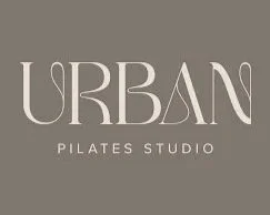 Logo for Urban Pilates Studio with stylized text on a gray background.