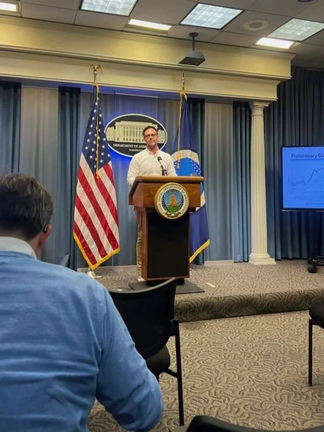 Dr. K. Aleks Schaefer presenting at the U.S. Department of Agriculture