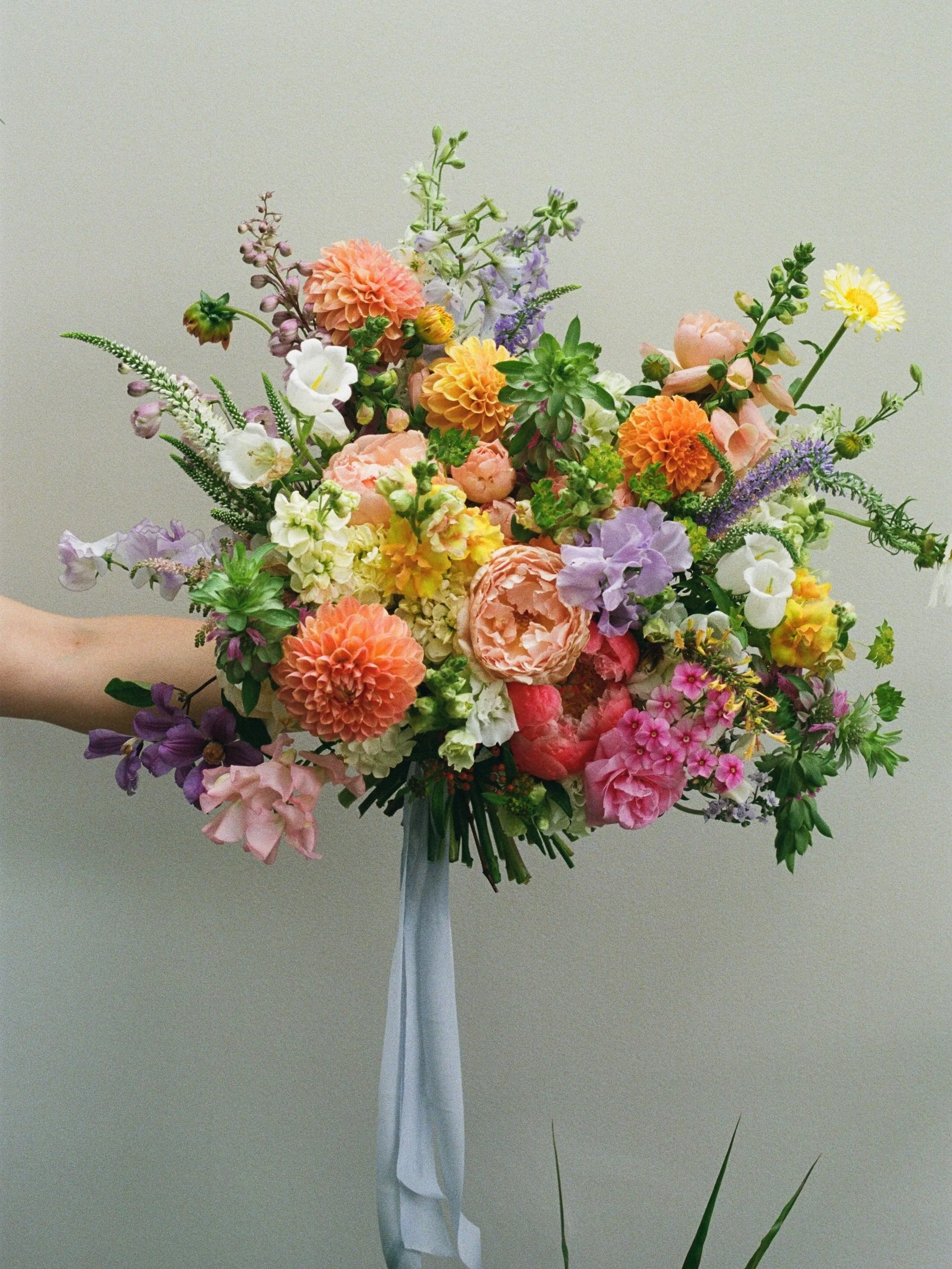 Logan&rsquo;s bridal bouquet on film 💕

A late May bouquet with dahlia, lemon mint, phlox, calendula, garden rose, Veronica, clematis, green gold, larkspur, sweet pea, peony, campanula, stock, snapdragon, agastache, foxglove, delphinium, cosmos, ast