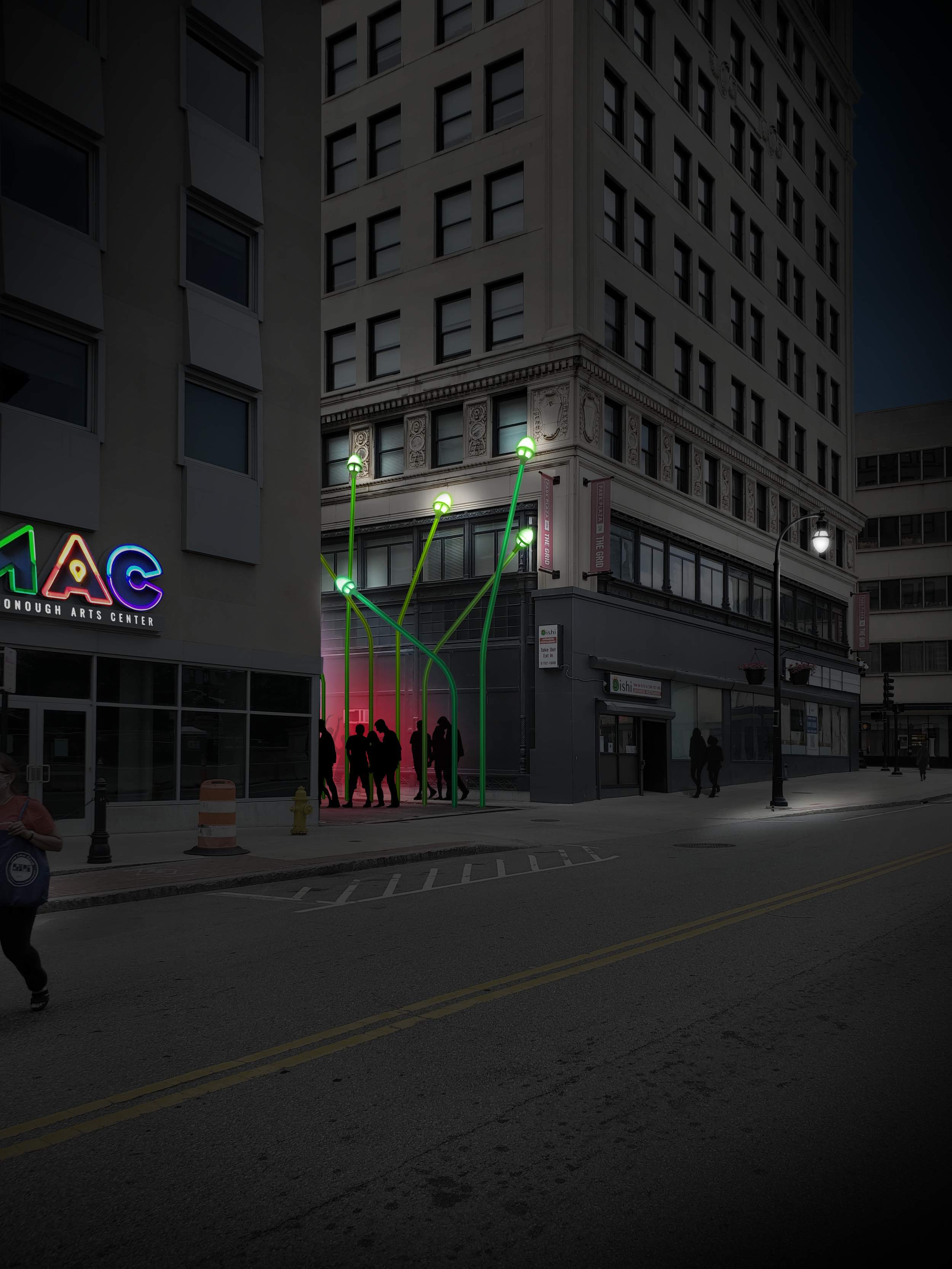 Nighttime city street scene with a group of people standing near a building entrance marked with neon lights and green street lamps, couple of banners hanging on the building, and trees on the sidewalk.