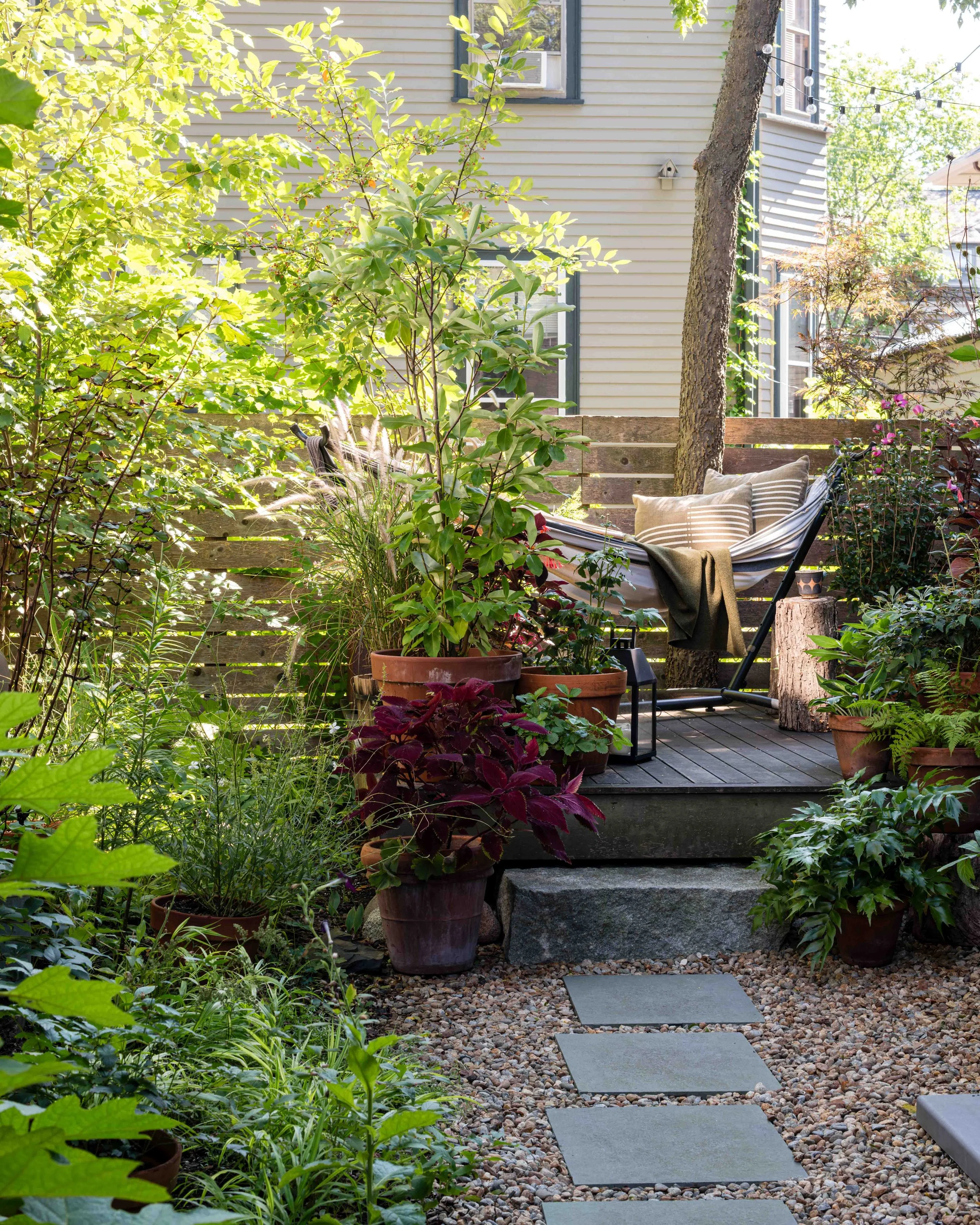   The Long Garden      I        Intimate outdoor rooms create a secluded refuge under a shady tree canopy