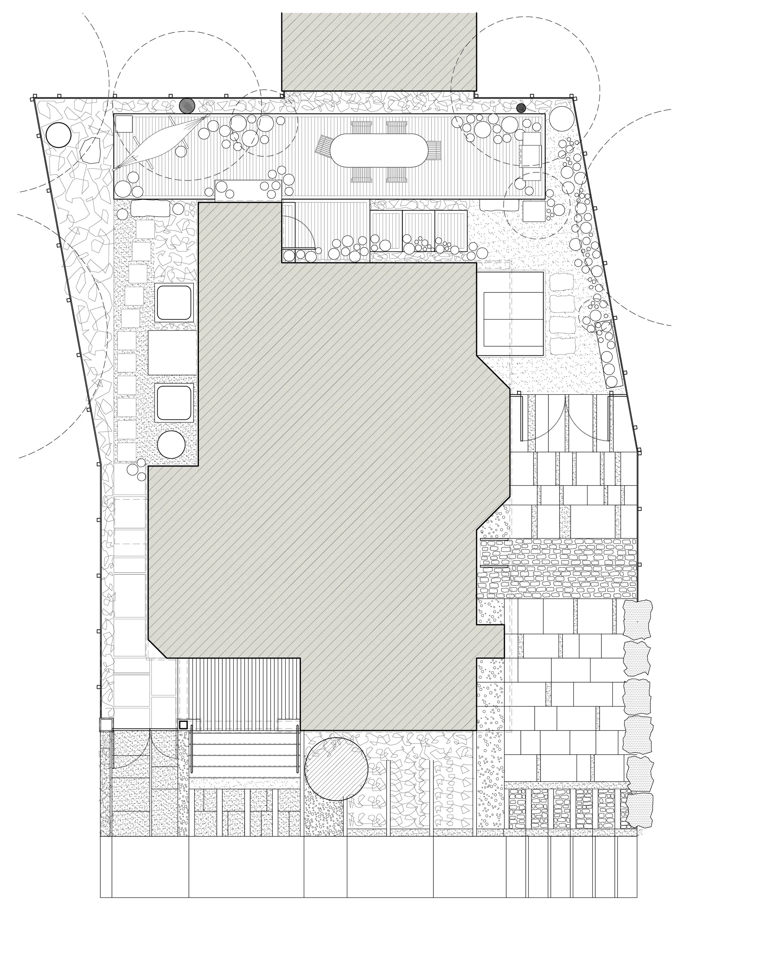 Architectural plan of a building layout with various outdoor and indoor areas including a yard, pathways, and patios.