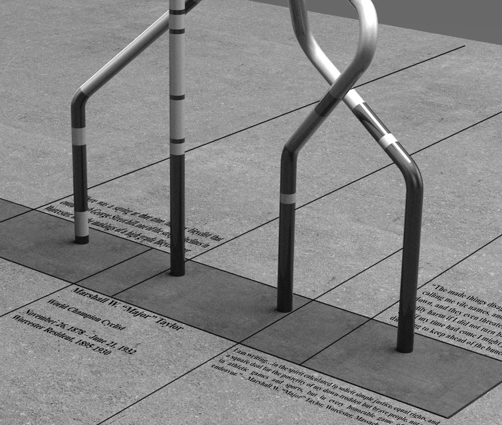 Close-up of two metal bicycle racks on a sidewalk, with engraved text on the concrete surface underneath, in black and white.