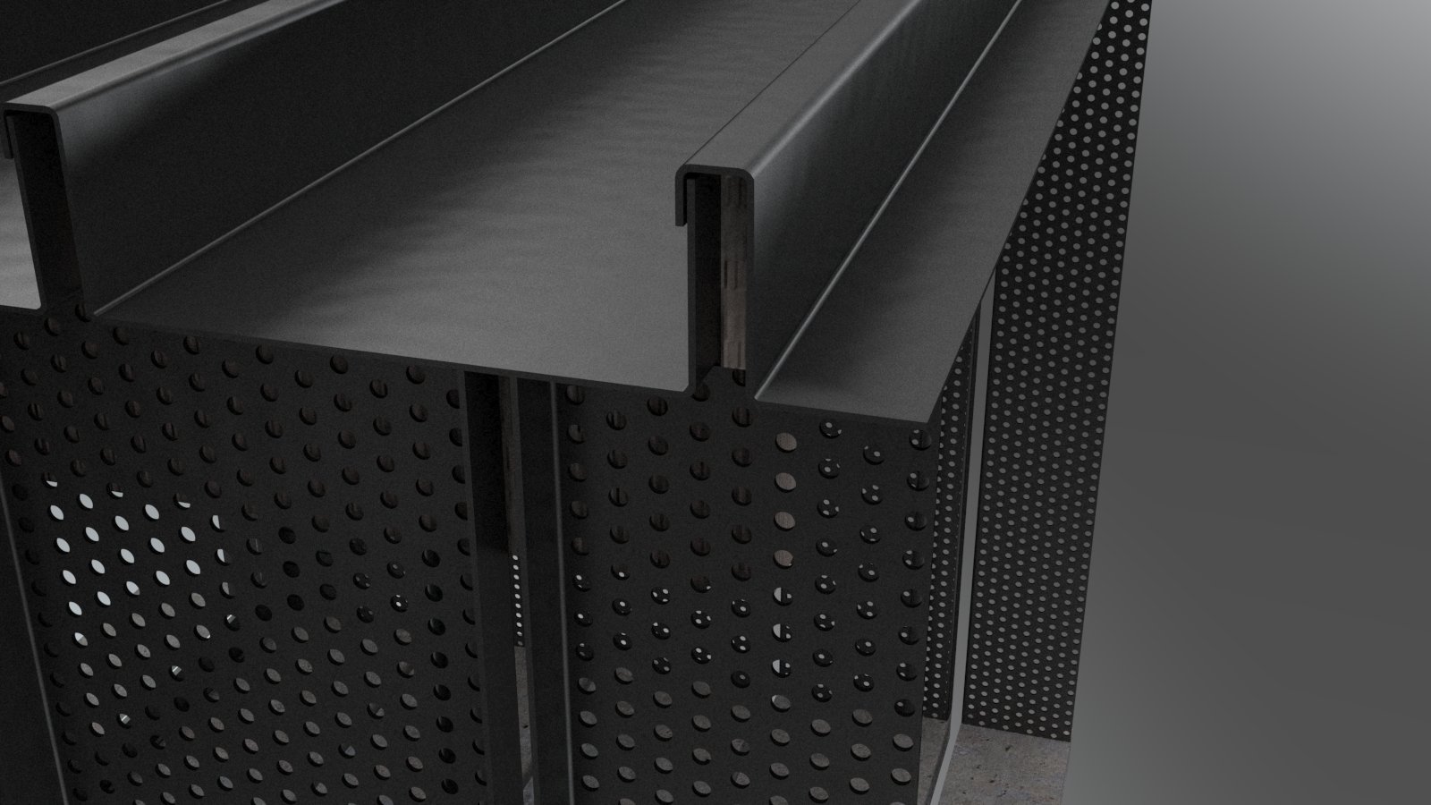Close-up of a black perforated metal furniture piece with a smooth, solid top surface, possibly a table or desk, against a gray background.
