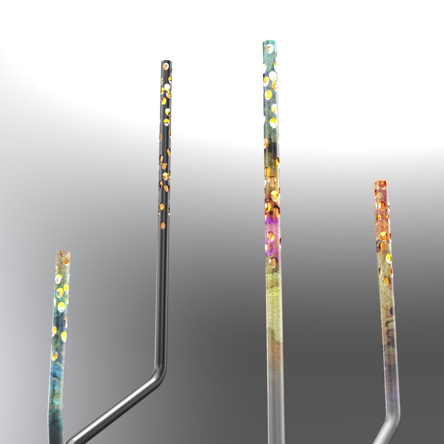 Close-up of four colorful, metallic, perforated tools or objects with gold holes, set against a gradient background.