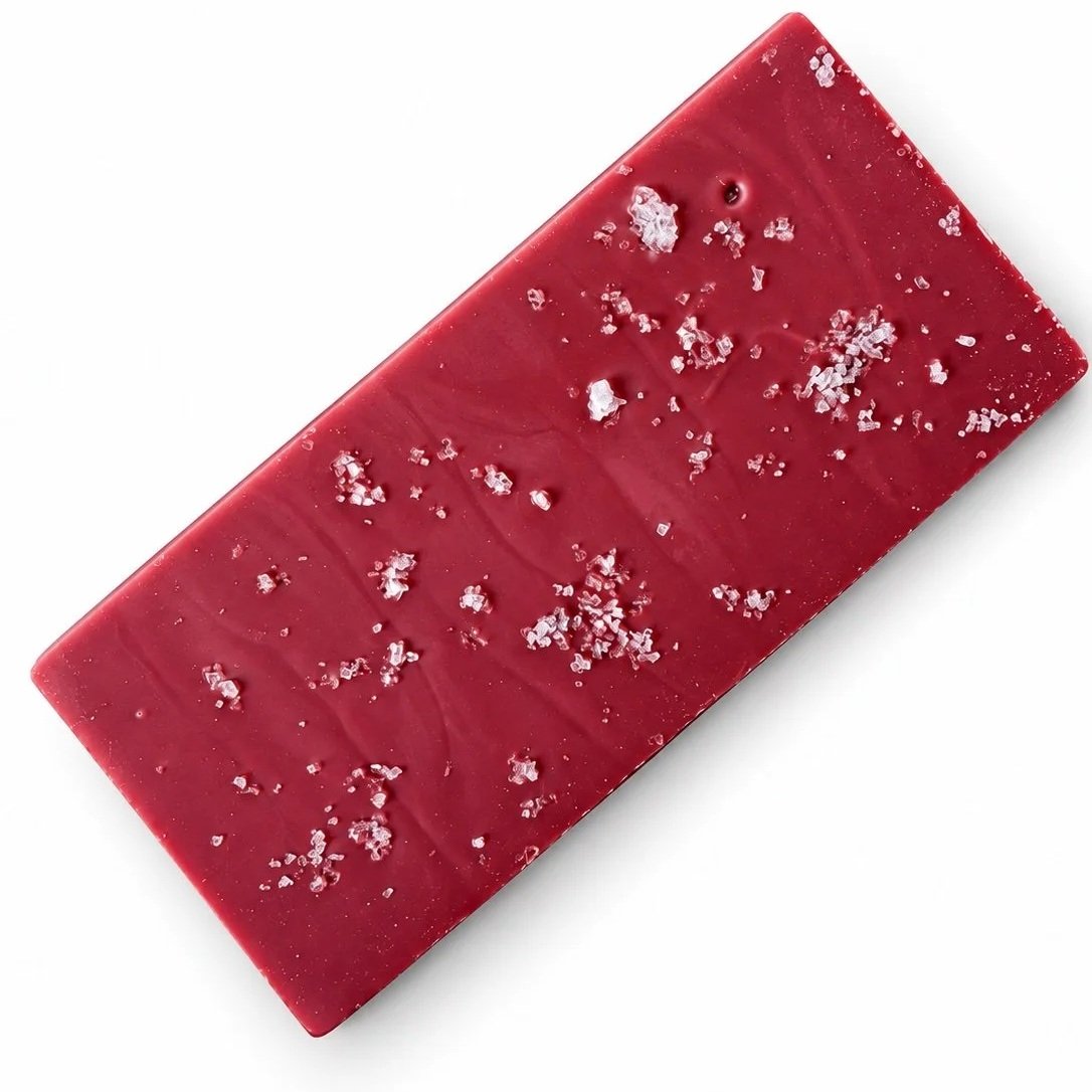 Pink rectangular chocolate bar finished with sea salt flakes.
