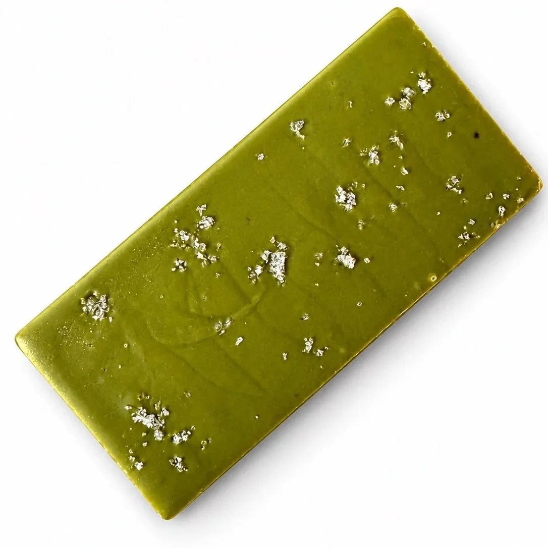 Green, rectangular chocolate bar finished with sea salt flakes.