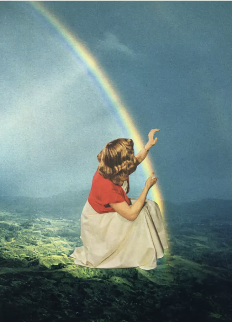 A woman with red hair, wearing a red top and a long beige skirt, sitting on a green landscape, reaching out towards a rainbow in the sky.