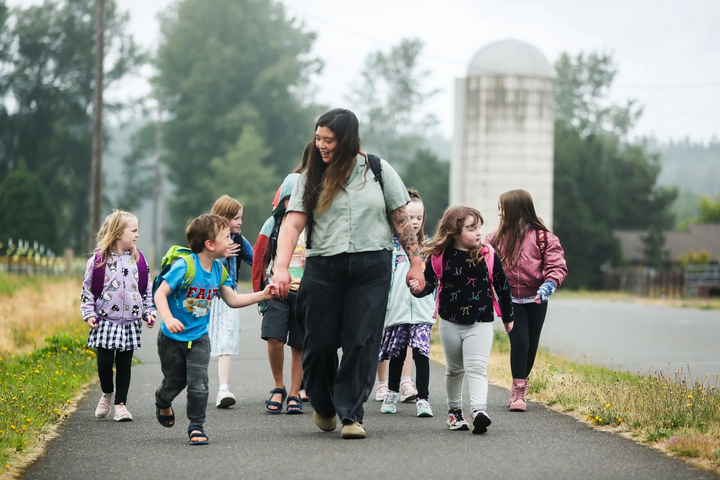Students hike with their teacher as a part of outdoor school