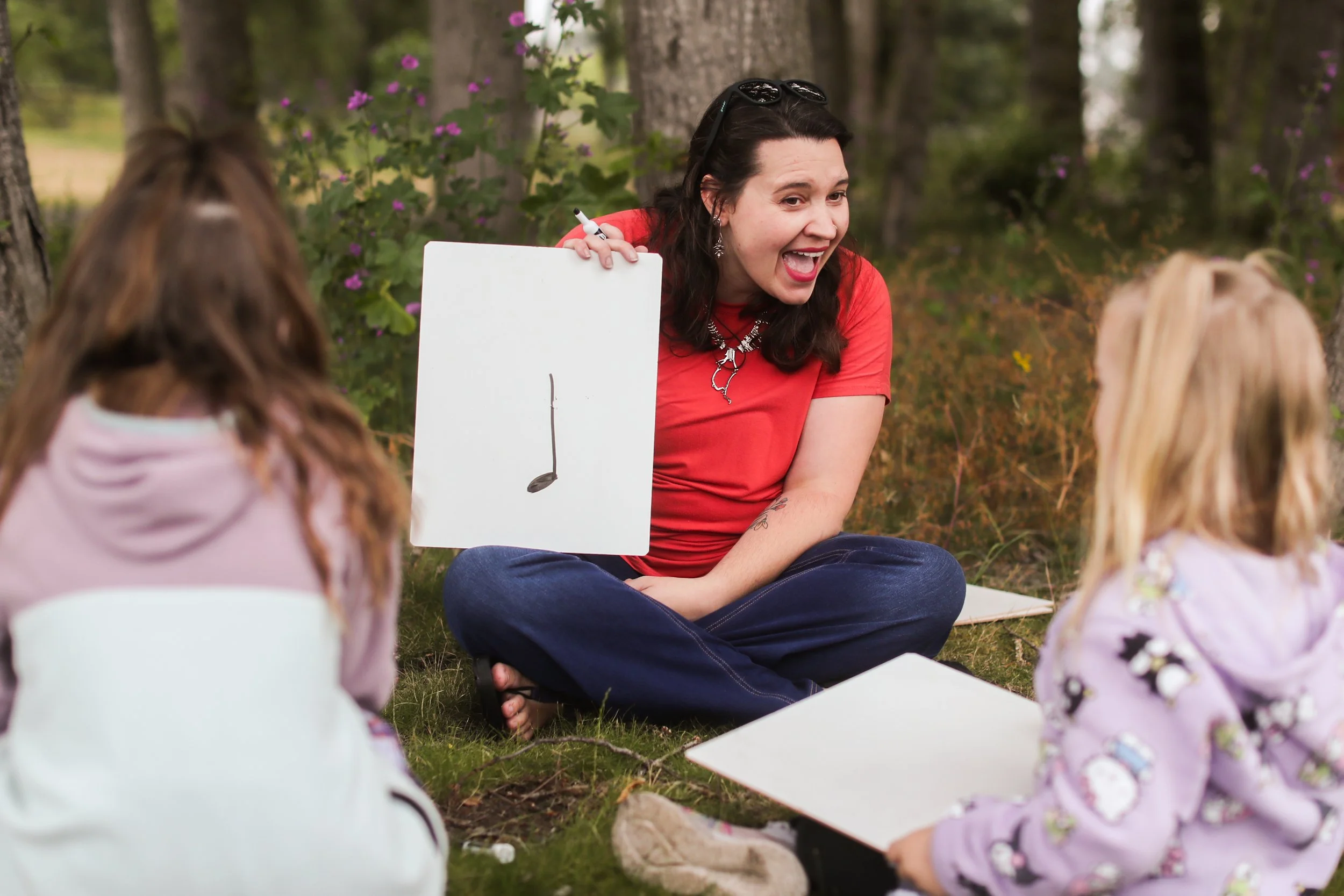 Students learn about music in an outdoor school setting