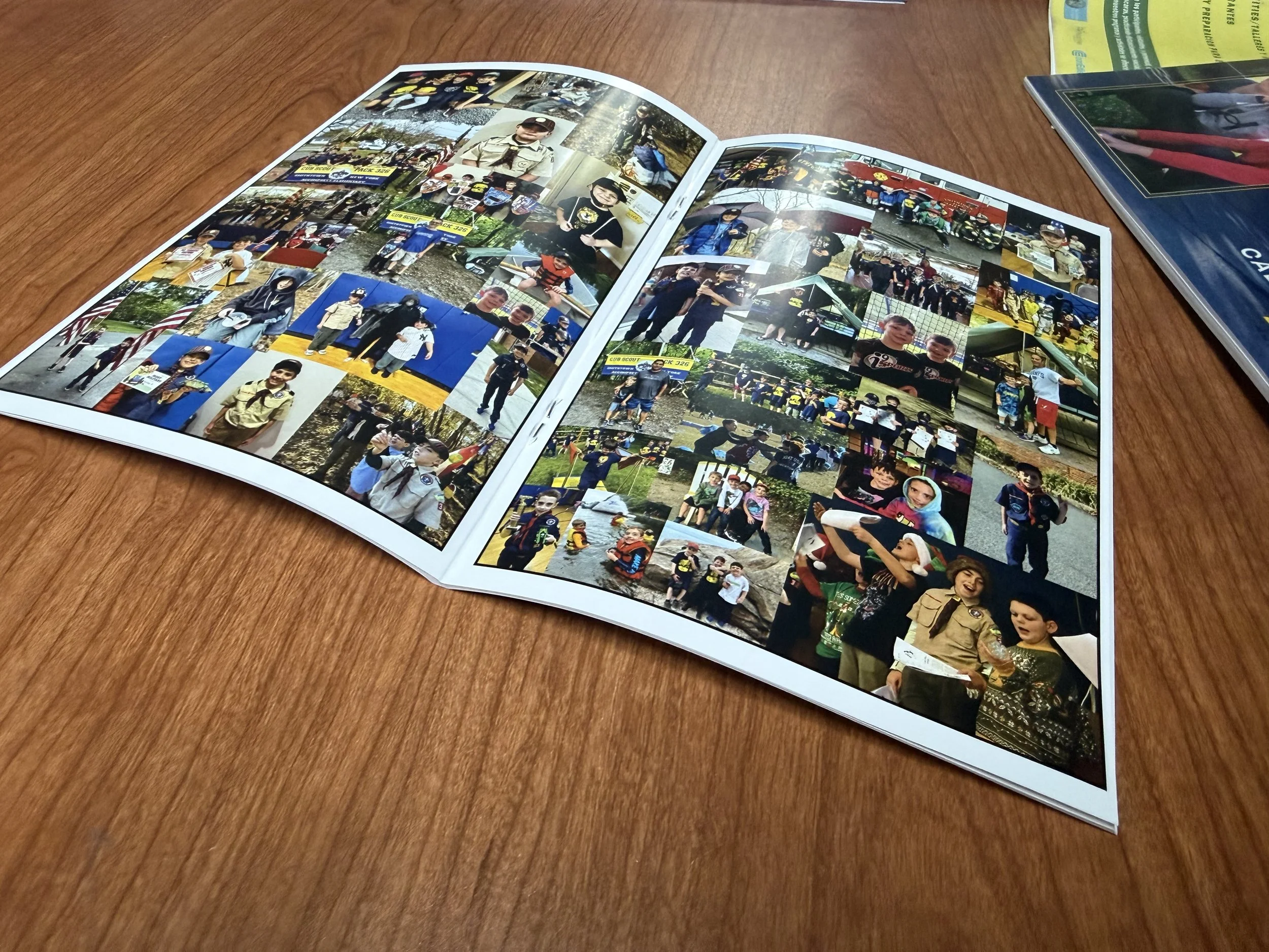 Open photo album on a wooden table displaying various photos of outdoor activities.
