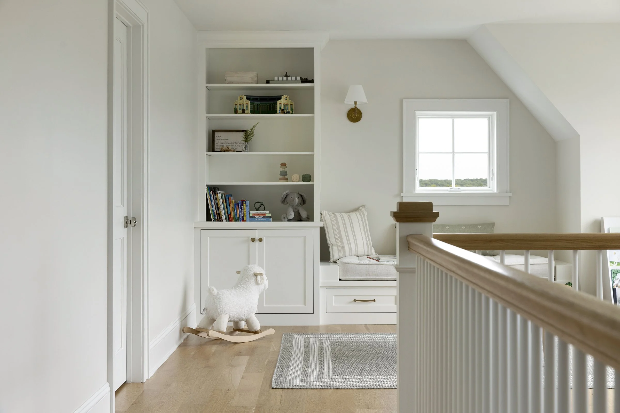 Built-in reading nook and shelving detail overlooking the countryside in a Rochester, Minnesota home.