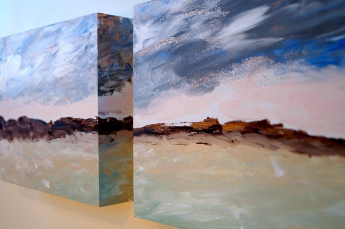 Two landscape paintings of a sky and land with clouds and horizon, displayed side by side.