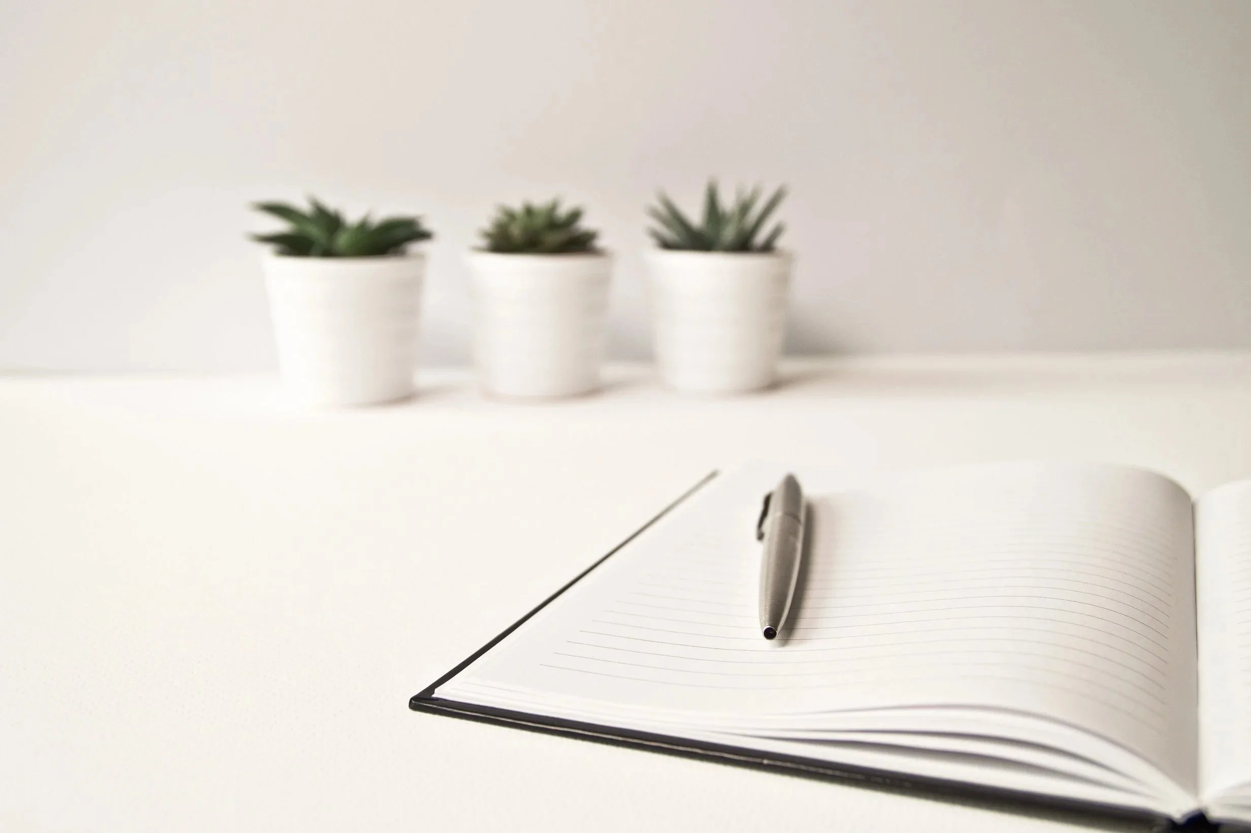 Desk with notepad to show communication.