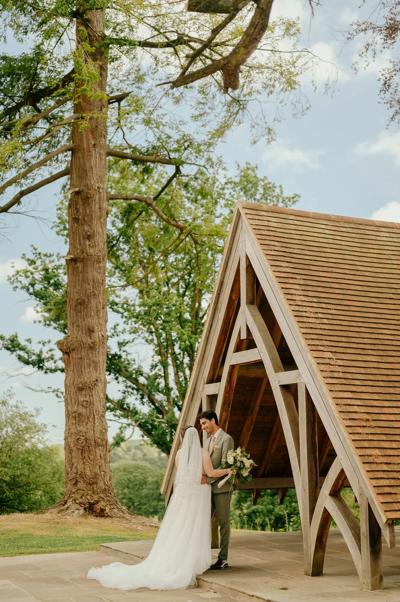 Bride & Groom pose for photos at highley manor West Sussex