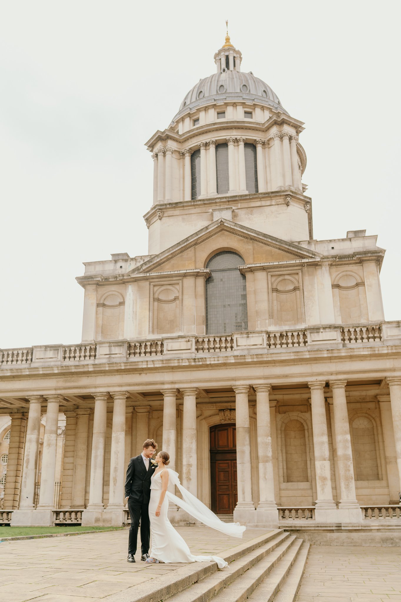 Bride and Groom stand in front of the Royal Naval College Greenwich