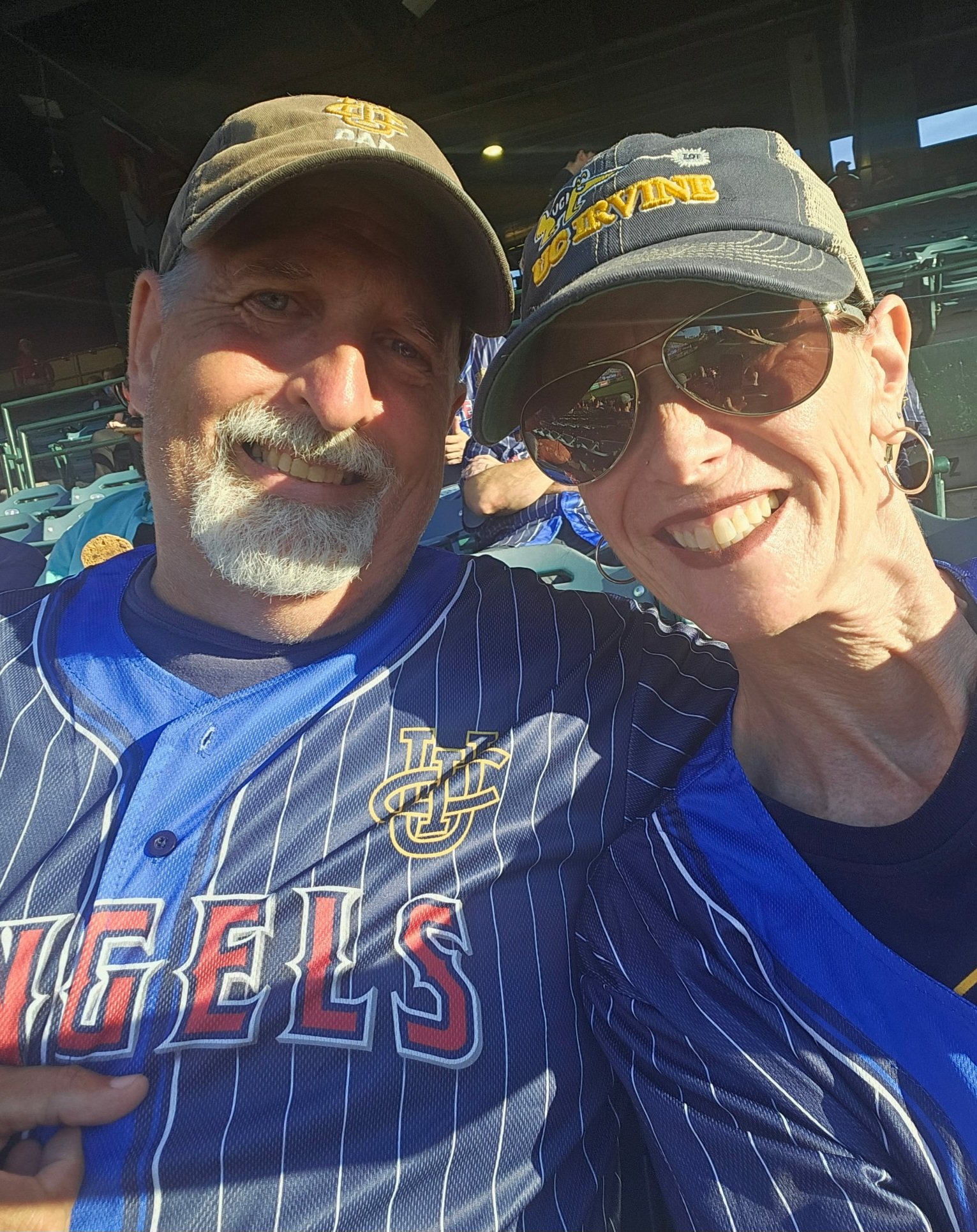 A man "Bill" and his wife at a baseball game