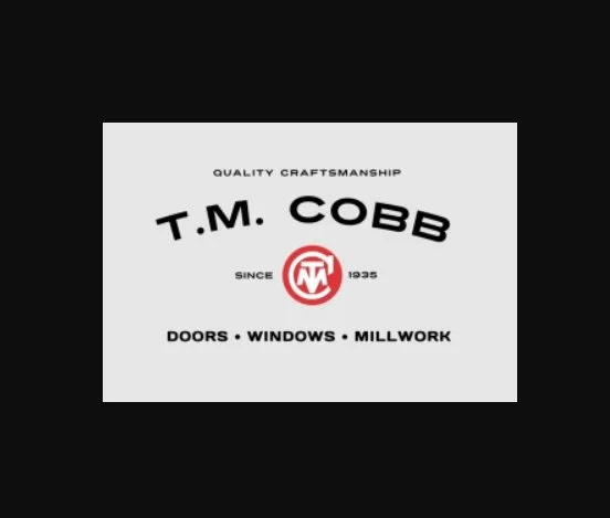 Logo for T.M. Cobb, a carpentry company specializing in doors, windows, and millwork, with the text 'Quality Craftsmanship with a red circular emblem and the year 1935.'