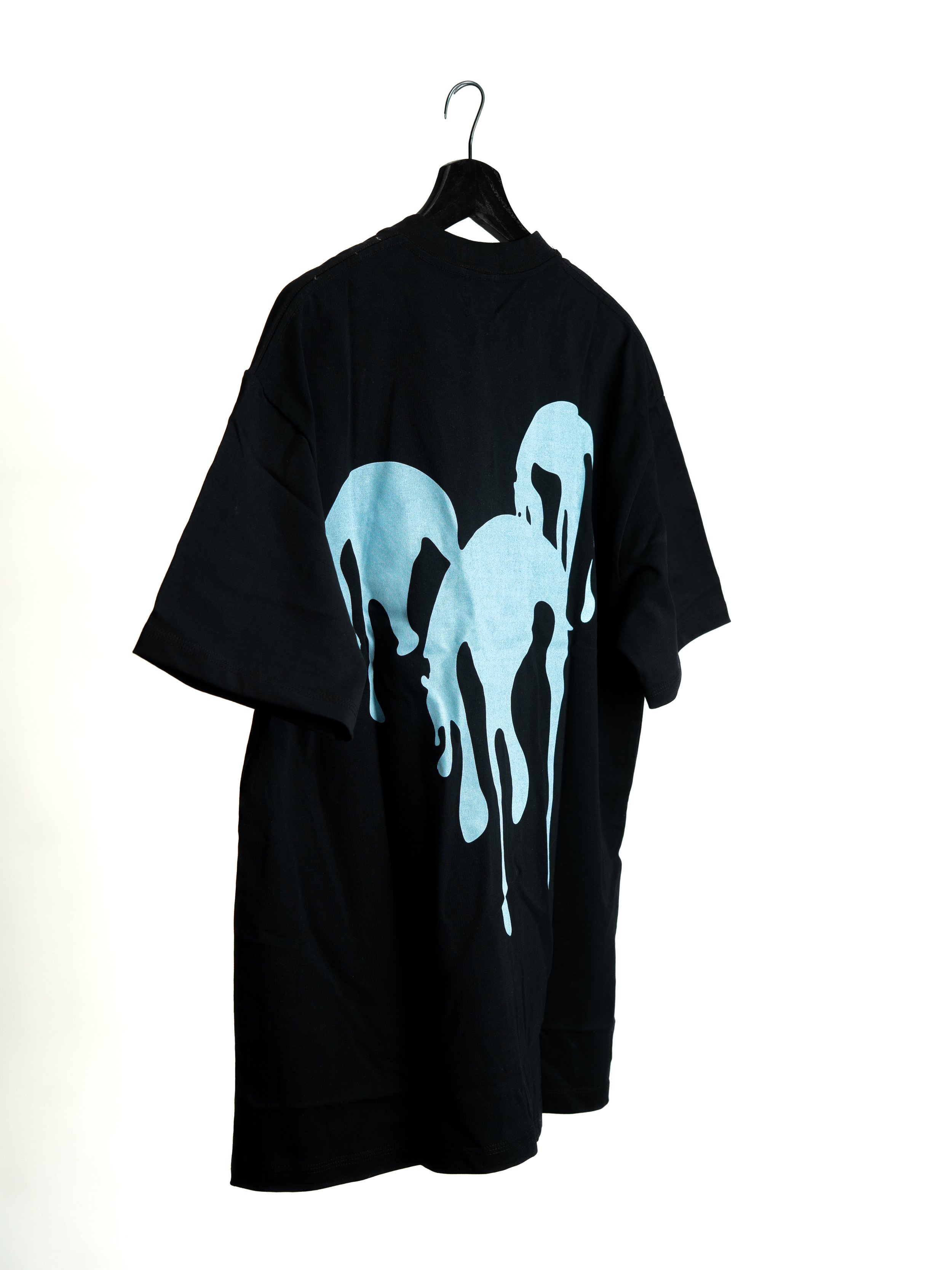 Black T-shirt with a large graphic of a Disney-inspired dripping rat design, hanging on a black hanger against a white background.