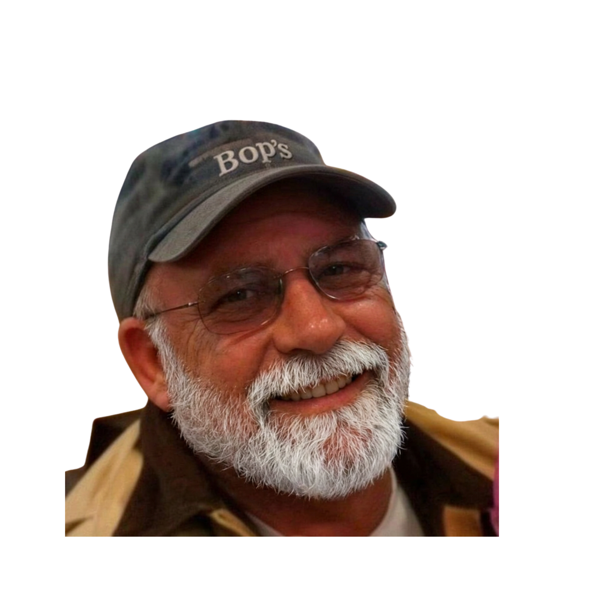 Close-up of a smiling older man with glasses wearing a camouflage baseball cap with the text 'BOP's' embroidered on it.