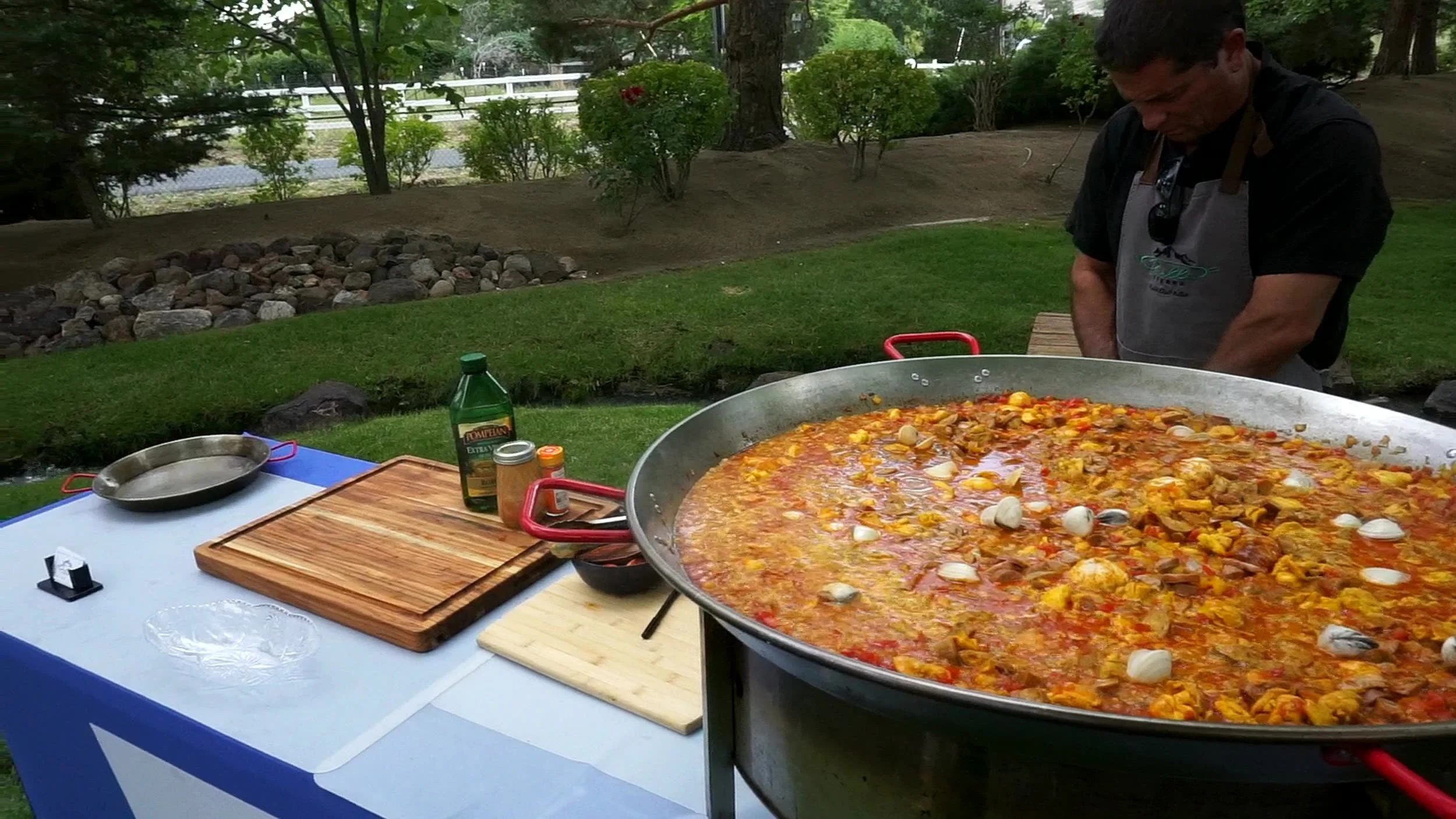 Chef Acho Martiarena cooking a four-foot paella at an outdoor event