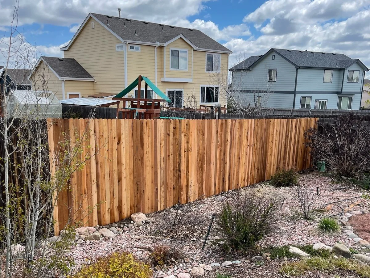 Finished cedar privacy fence in a Colorado Springs backyard