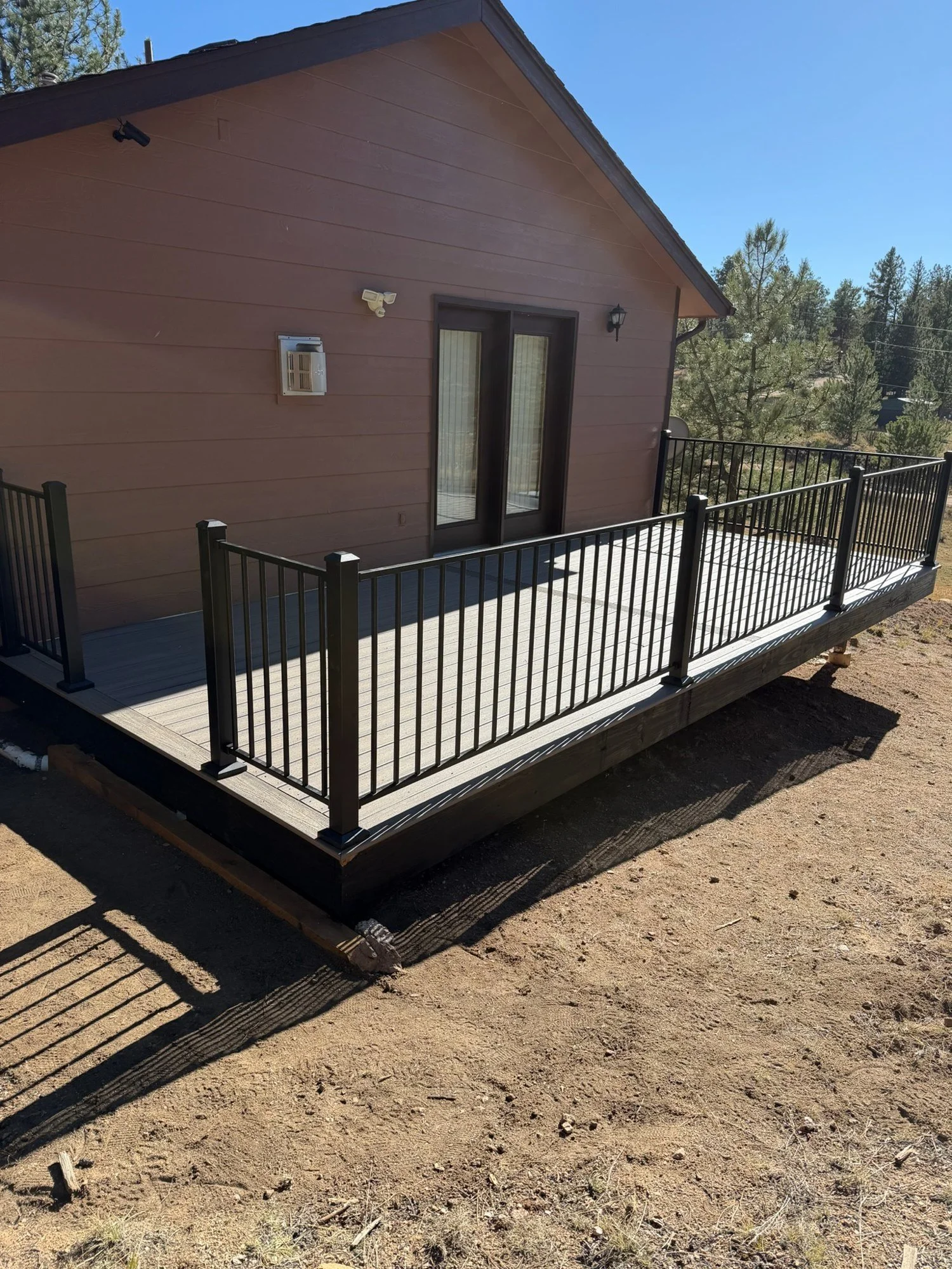 Low deck with black railing, Woodland Park