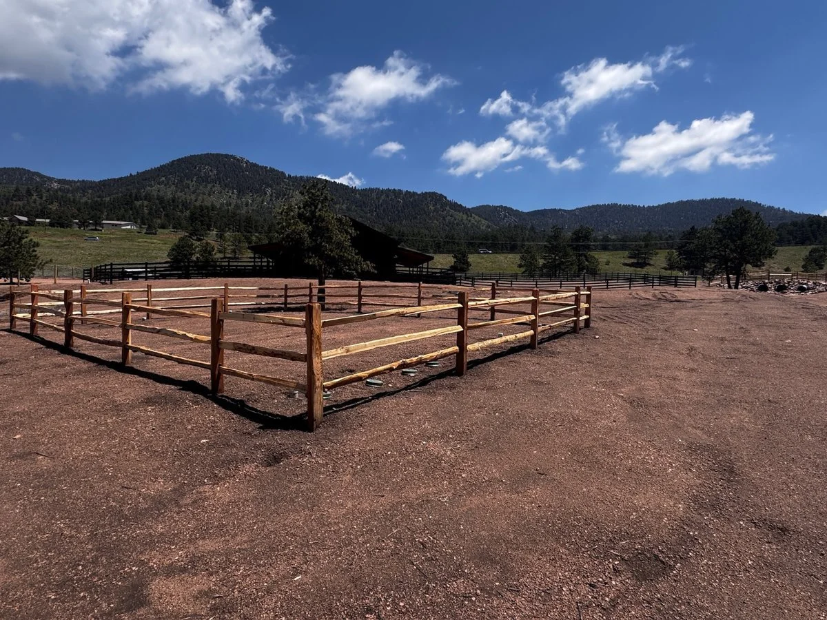 Cedar split rail pen with mountains behind
