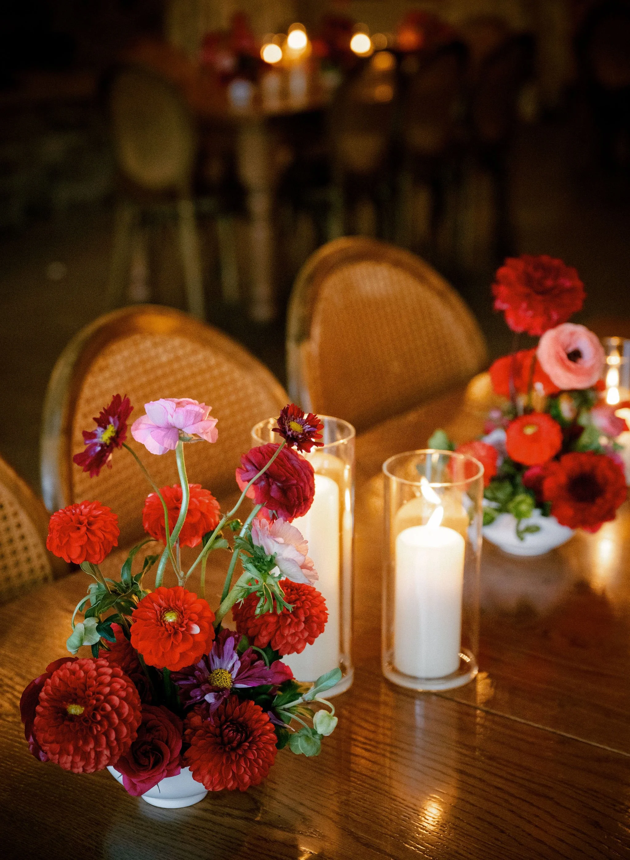 Colorful Floral Centerpiece and Candlelit Tablescape at a Wedding Planned by Faith Ferguson Productions