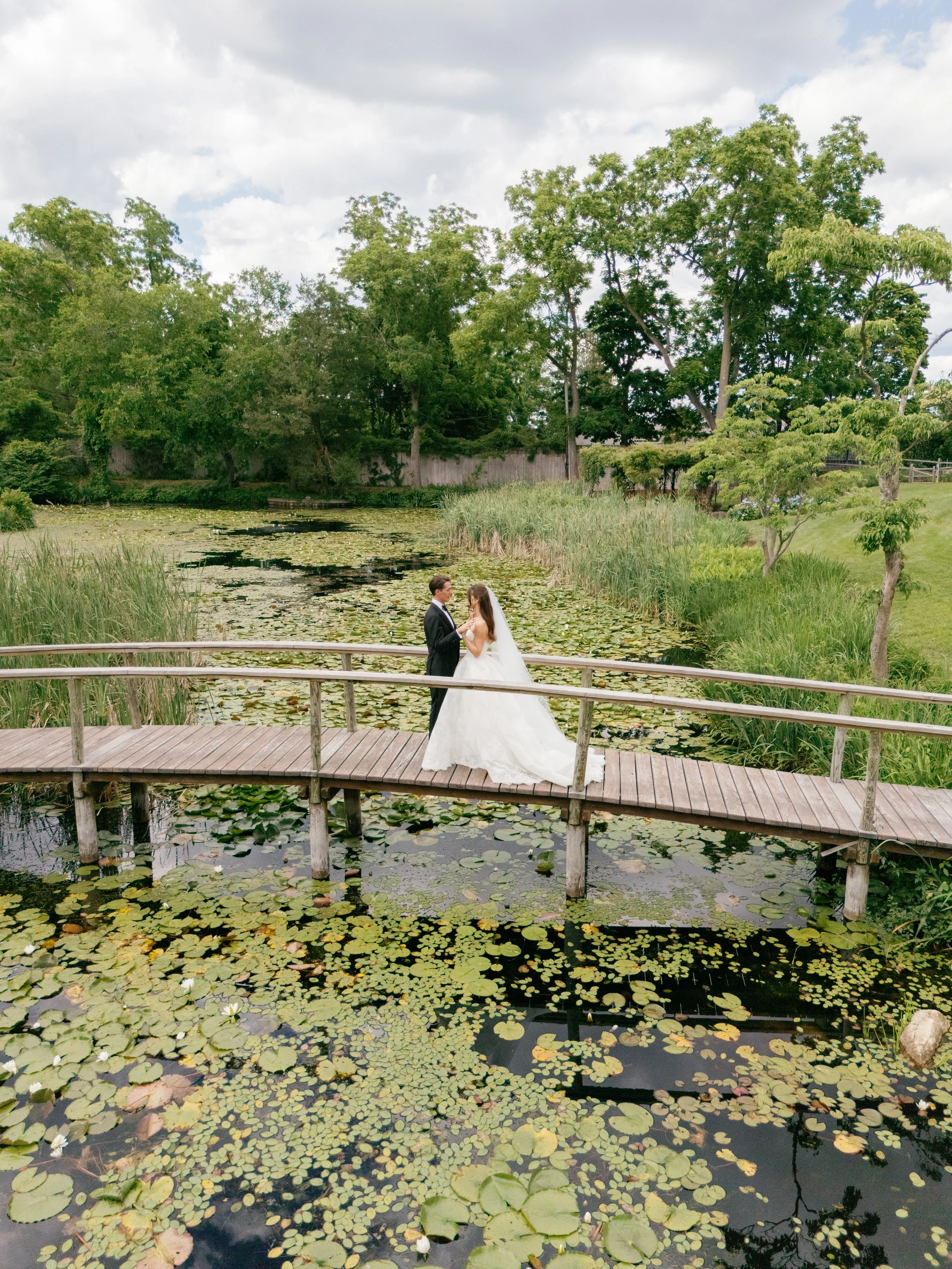 Bride and Groom on a Bridge at a Luxury Wedding Planned by Faith Ferguson Productions