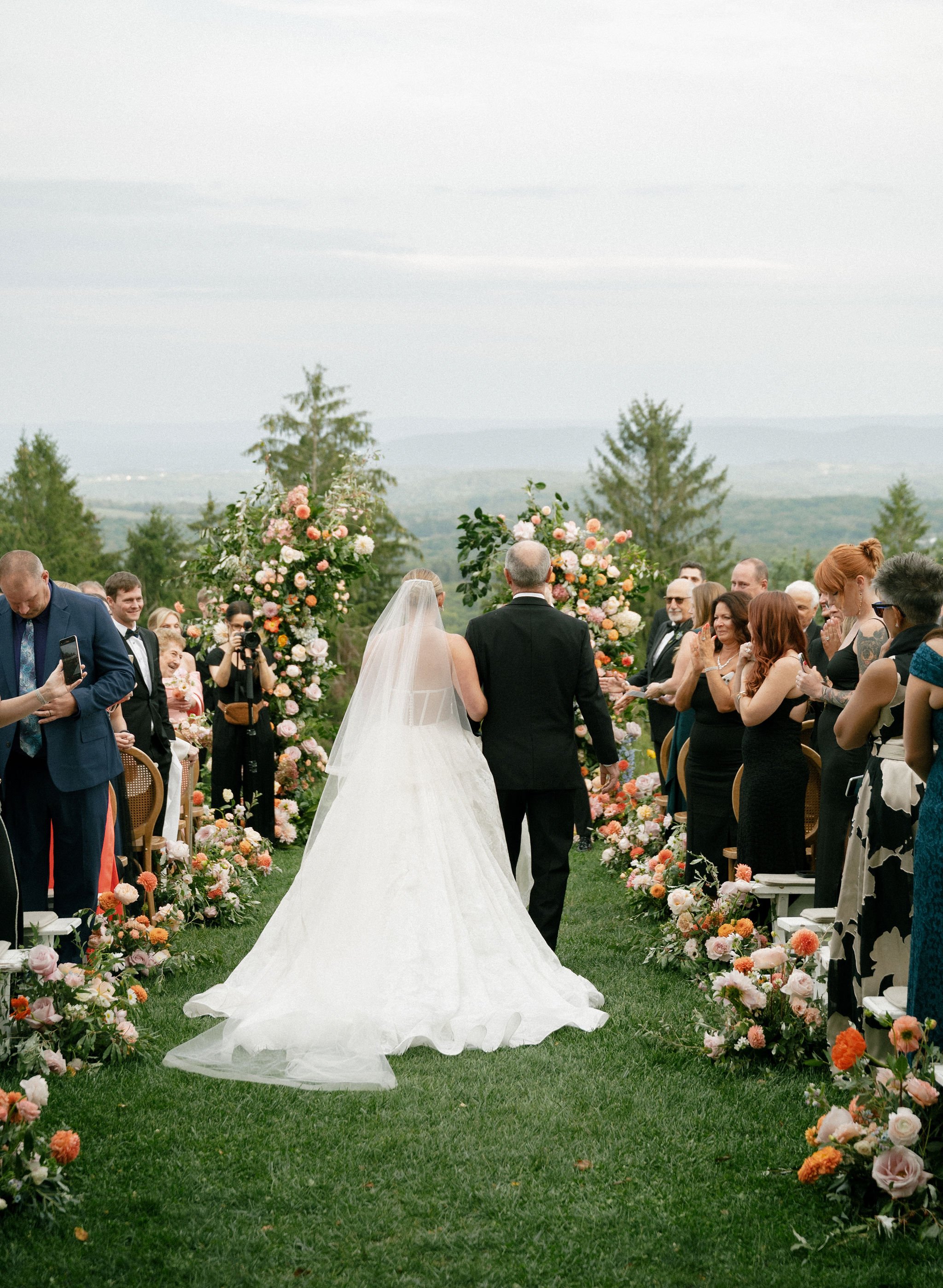 Bride Walking Down the Aisle at Cedar Lakes Estates at a Wedding Planned by Faith Ferguson Productions
