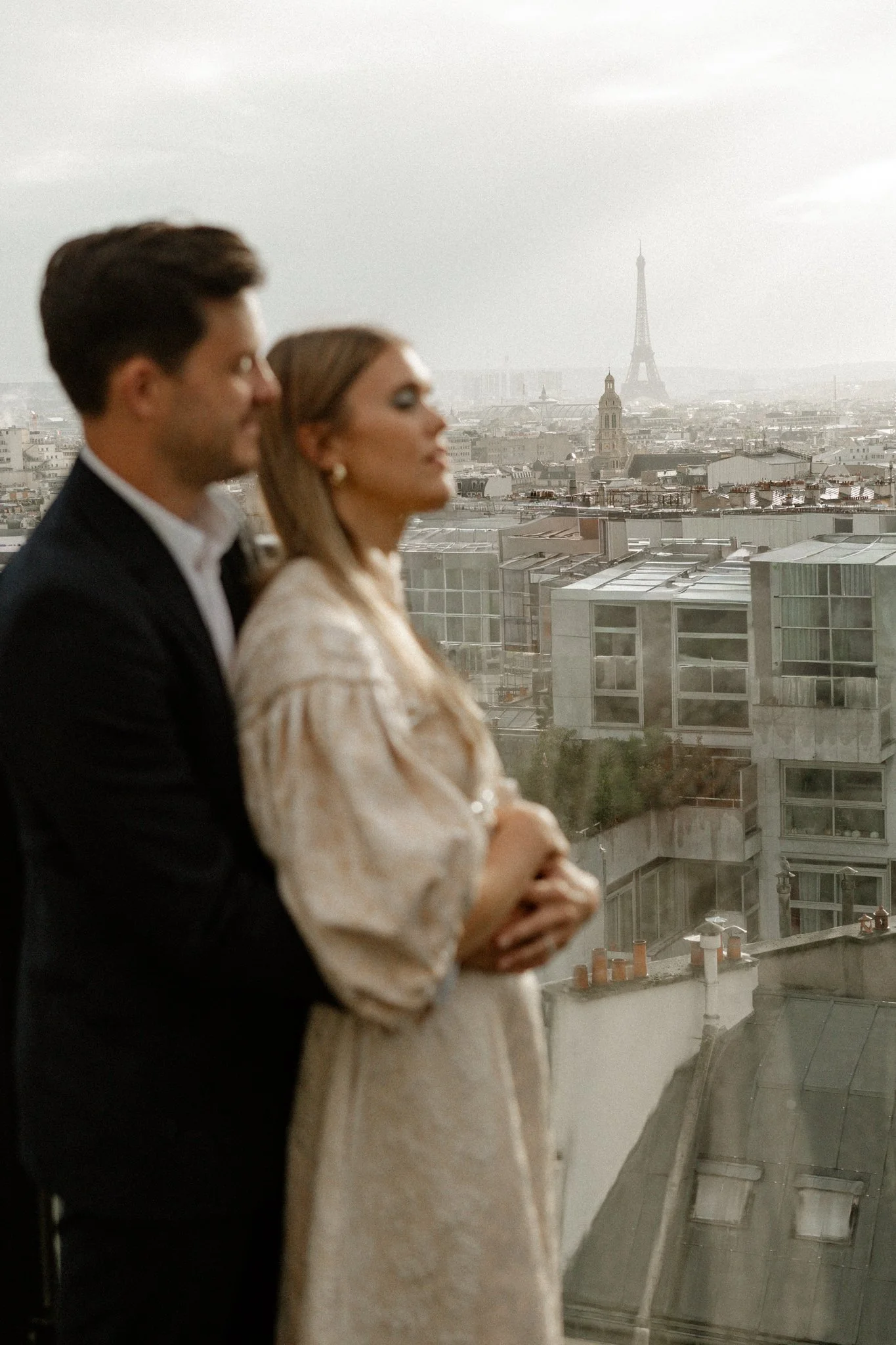 Couple Overlooking the Eiffel Tower at a Luxury Destination Wedding Planned by Faith Ferguson Productions