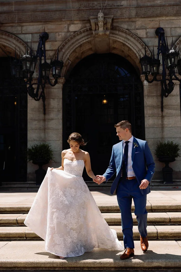 Bride and Groom on the Steps for their Luxury Destination Wedding in Boston Planned by Faith Ferguson Productions