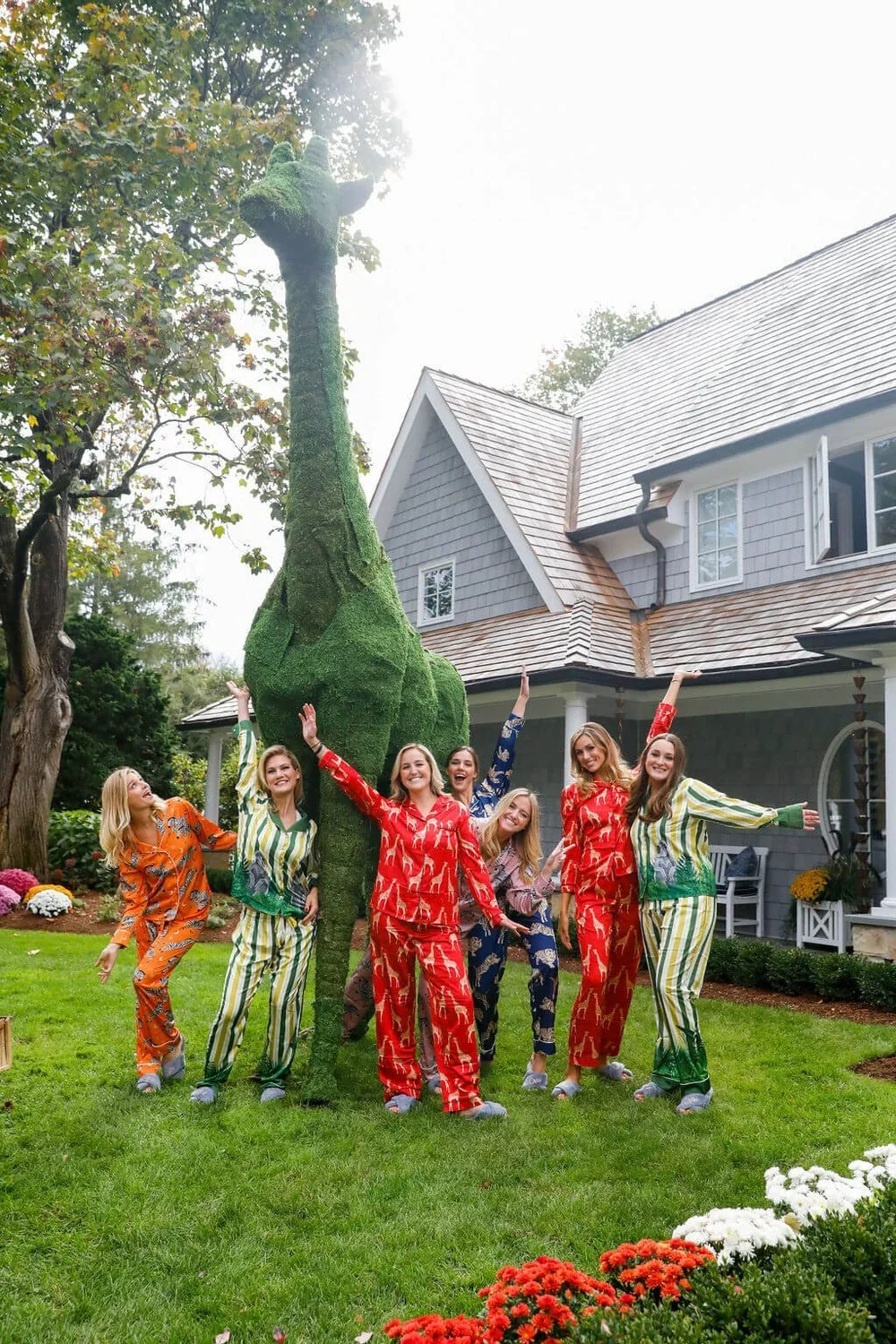 Bridal Party in PJs by a Large Giraffe Topiary at a Private Estate