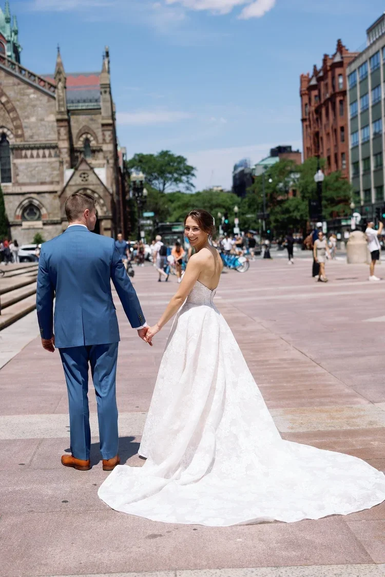Bride and Groom on the Streets of Boston at their Luxury Destination Wedding Planned by Faith Ferguson Productions