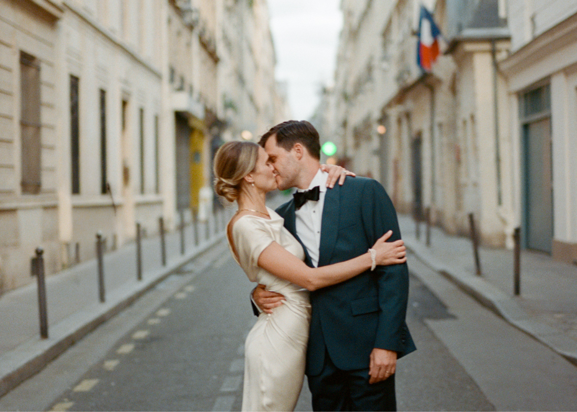 Wedding Couple Kissing on Street at Their Paris Destination Wedding