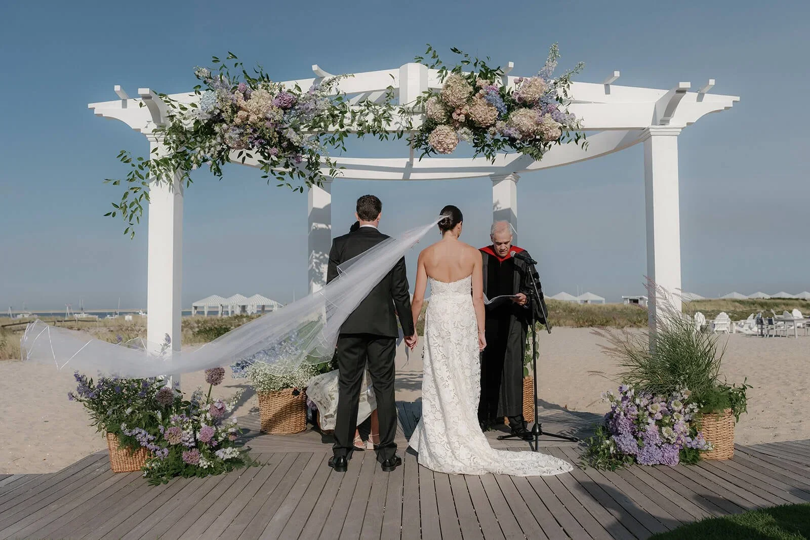 Bride and Groom Saying Vows on Beach at Cape Cod Destination Wedding Planned by Faith Ferguson Production